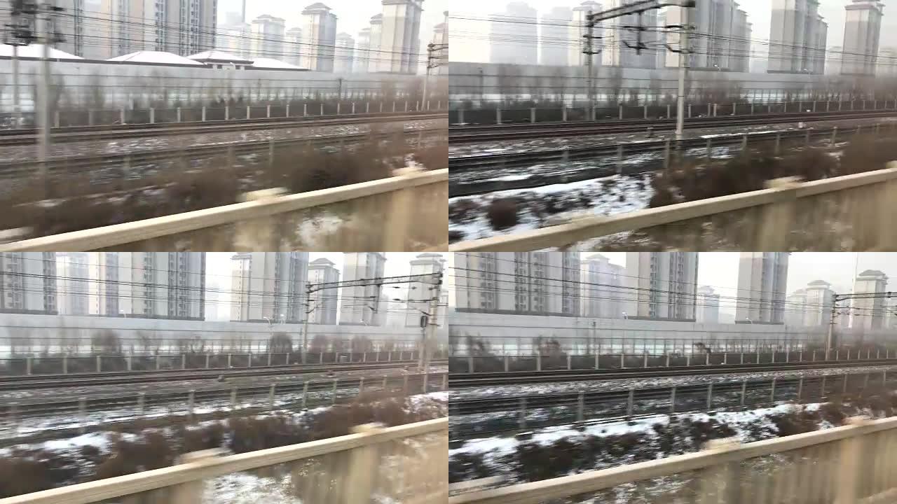 中国北京子弹头列车窗口的城市景观。