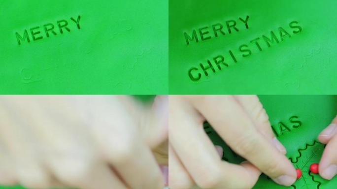 卷绿色软糖和邮票字样圣诞快乐。特写。