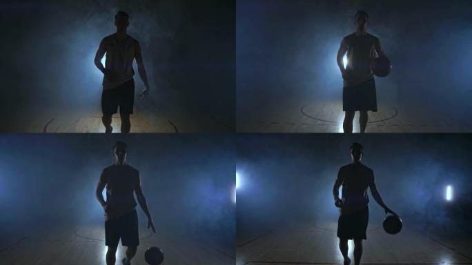 篮球运动员在黑暗的房间里直奔摄像机，烟雾中的背光照在慢动作中看着摄像机。Steadicam
