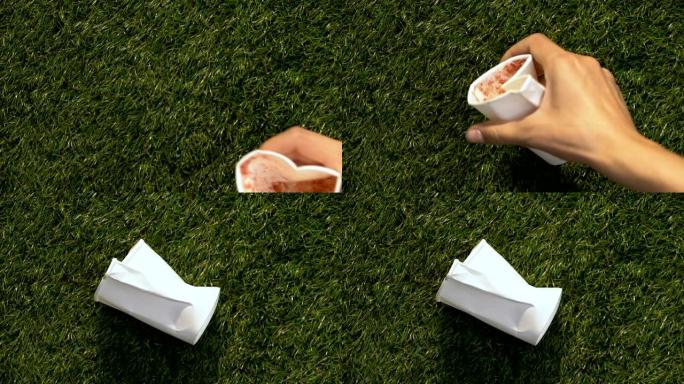 在公园的绿草地上扔二手纸帽，乱扔垃圾的问题概念