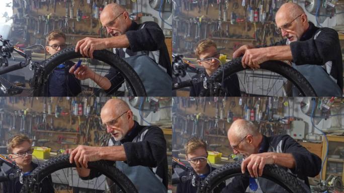 SLO MO Boy看着他的爷爷卸下自行车上的外轮胎以修补爆胎