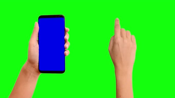手握智能手机，触摸在色度键绿色屏幕上滑动
