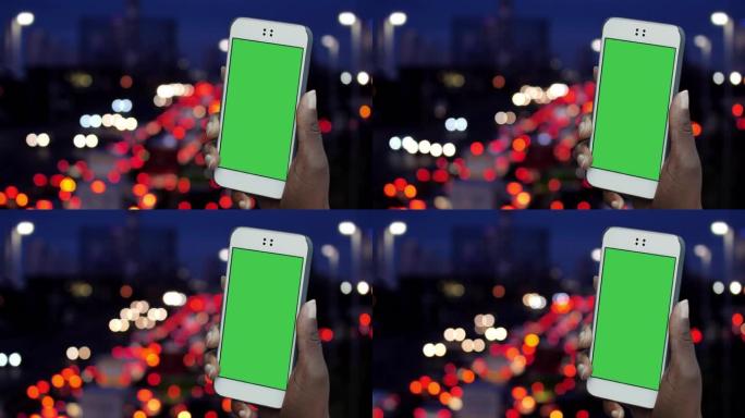 Cinemagraph，智能手机在夜间与城市交通保持联系。可循环。可用