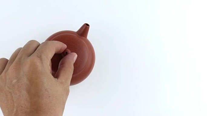 俯视图手打开一个中国茶壶。