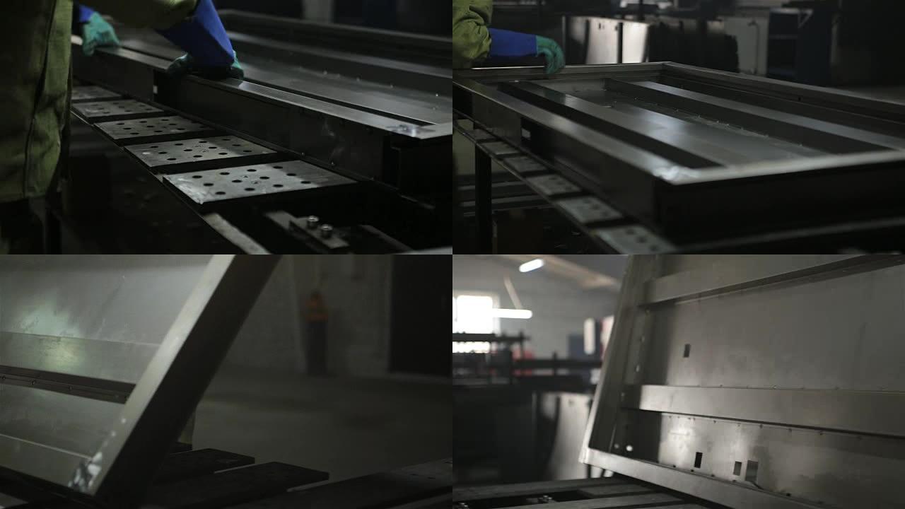 焊工焊接门的金属框架的细节。
