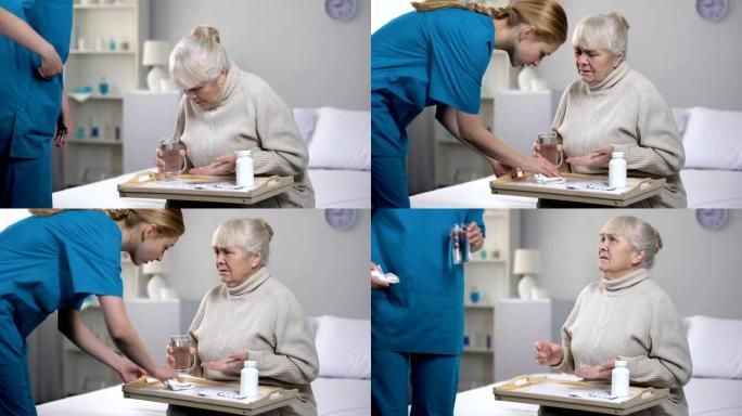 老年女病人吃药时把水洒在托盘上，服务不好