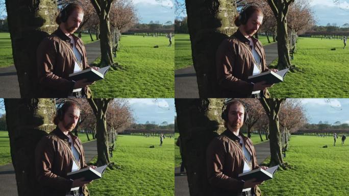 在爱丁堡的草地上读书的人