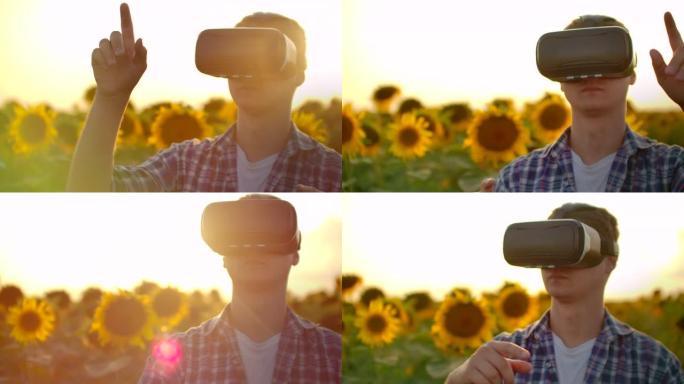 技术农业的概念。虚拟现实在农业中的应用。日落时的农民用手势控制农场和向日葵。