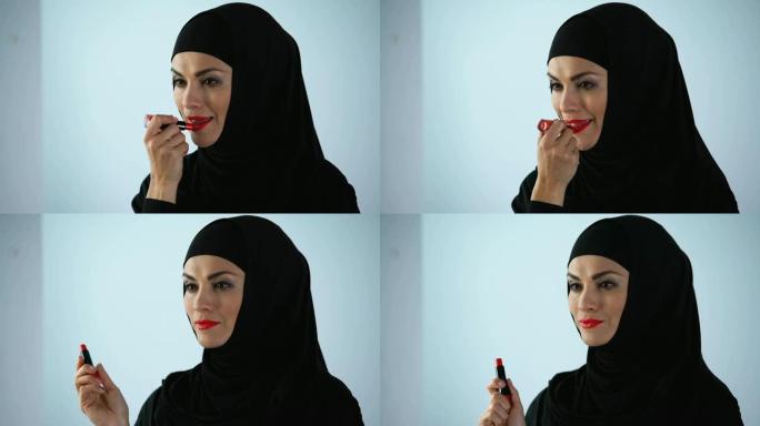 穆斯林女性涂红色唇膏，明亮的妆容，风格和美丽的外观