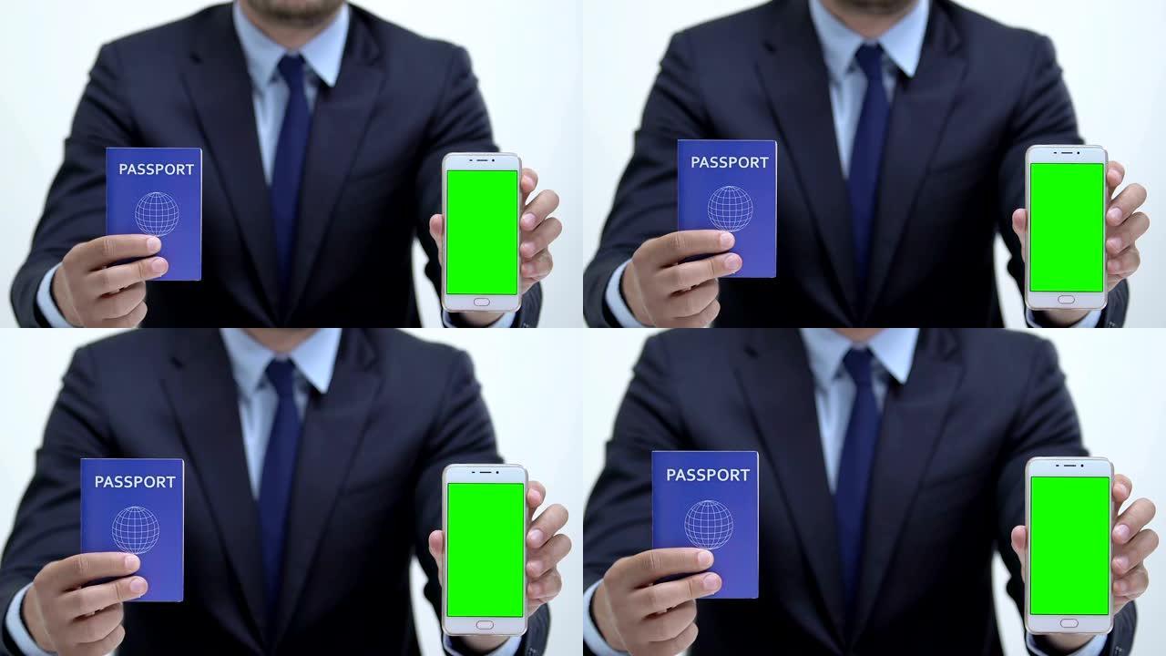 经理拿着护照和智能手机，绿屏，在线注册