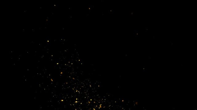 金色闪闪发光的星星尘埃圈的痕迹闪闪发光的颗粒在黑色