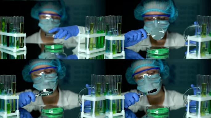研究人员用放大镜分析培养皿中的绿色粉末颜料