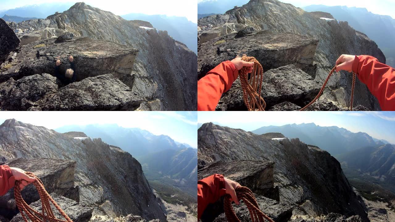 登山者准备帮助同伴走出高山裂缝