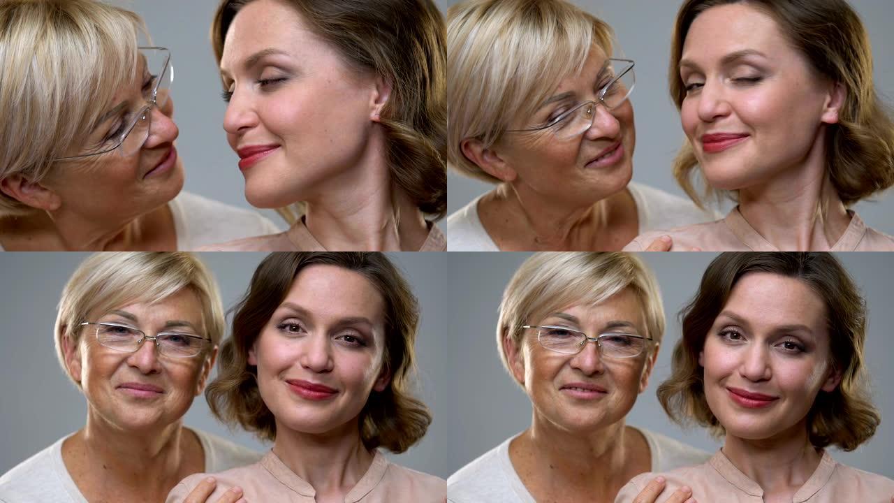 两个不同年龄的女人在镜头前微笑，年龄变化的护肤，特写镜头