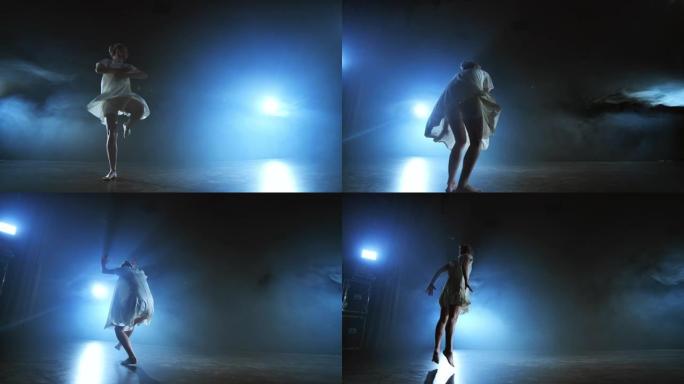 穿着白色短裙的现代女孩舞者表演塑料美丽的戏剧性舞蹈，在舞台上奔跑，摔倒在地板上旋转。灯笼和烟雾