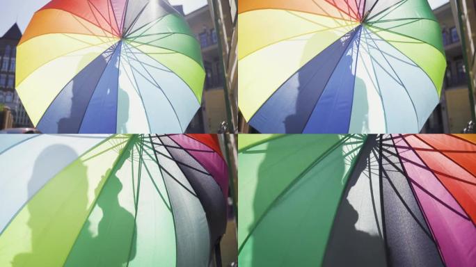 那个站在街上的五彩雨伞后面的女人。