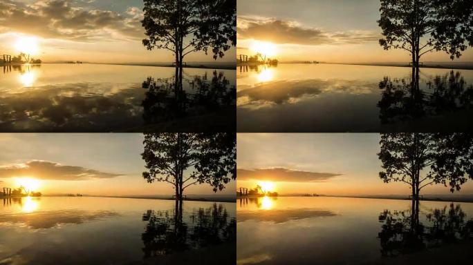 荡漾的游泳池水中反射着金色的日落。延时