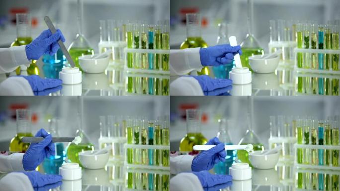 生物化学家从试管中提取乳霜样品，有机美容产品，皮肤病学