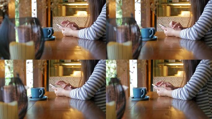 女人在咖啡咖啡馆用咖啡触摸桌子上的智能手机