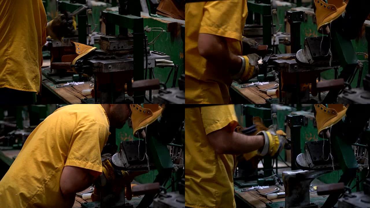 男性工人在制鞋厂用压力机粘合鞋底