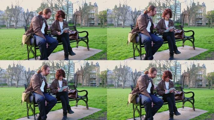 男人和女人坐在公园的长椅上，拿着书和笔记