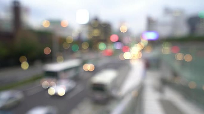 抽象模糊背景: 日本樱木日落时名古屋市景和行人