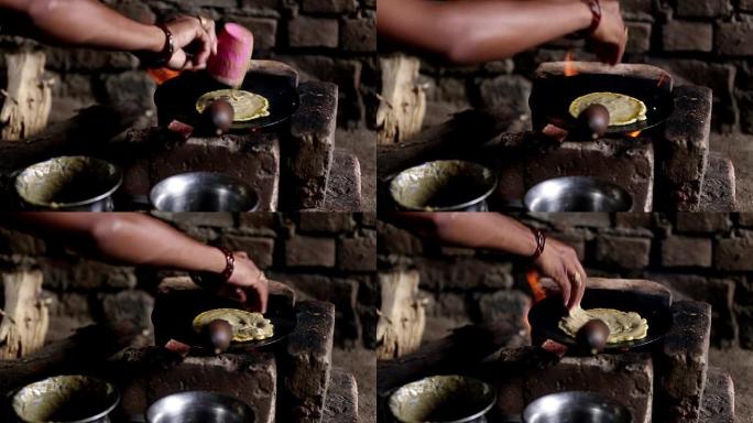 妇女在泥炉上做饭妇女在泥炉上做饭