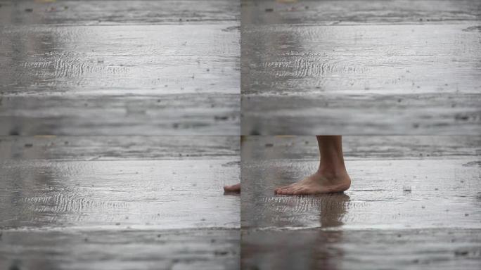 女人在雨天走在城市街道上