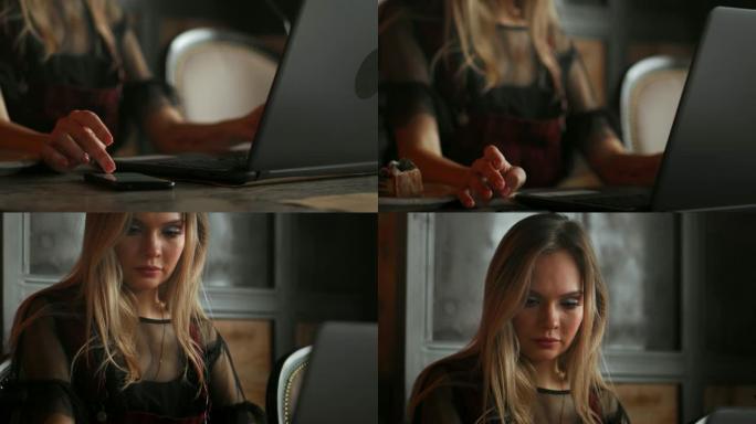 年轻女子坐在咖啡店的木桌旁，喝咖啡，使用智能手机。桌子上是笔记本电脑。女孩浏览互联网，聊天，写博客。