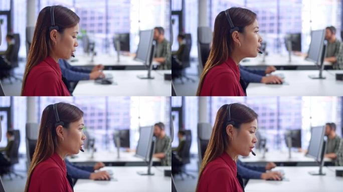 LD女性亚洲呼叫中心代理在现代办公室的办公桌上提供客户服务