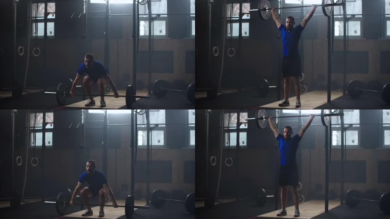 强壮的人在健身房做慢动作的杠铃抓举运动