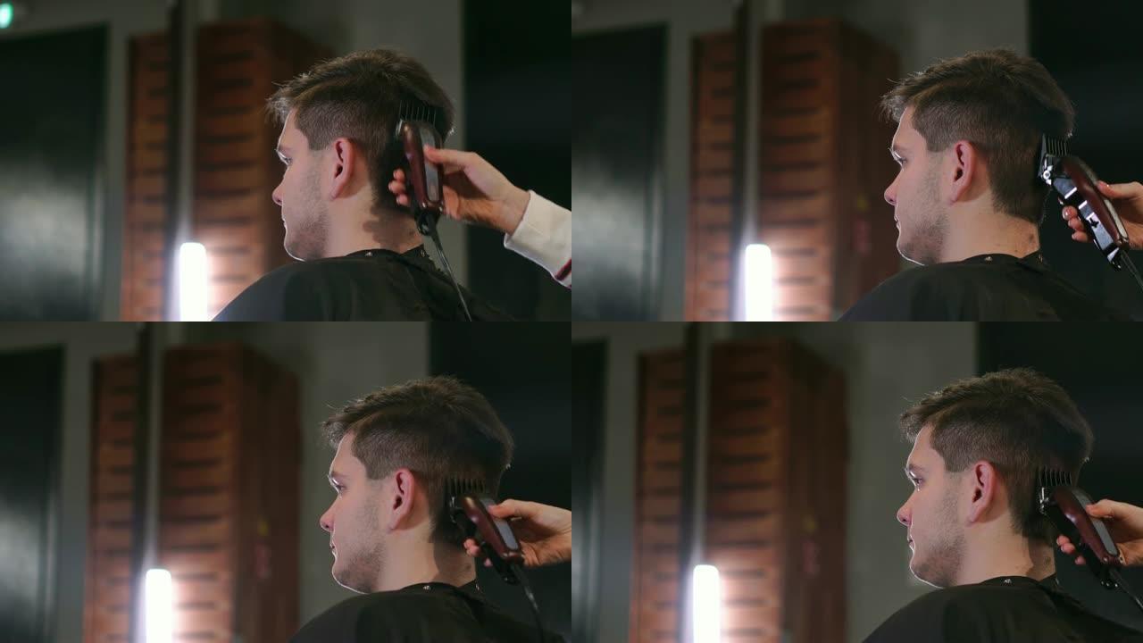 理发店或发廊的男士发型和理发。梳理头发。理发店。女理发师在男士发廊理发成年男子。工作场所的理发师