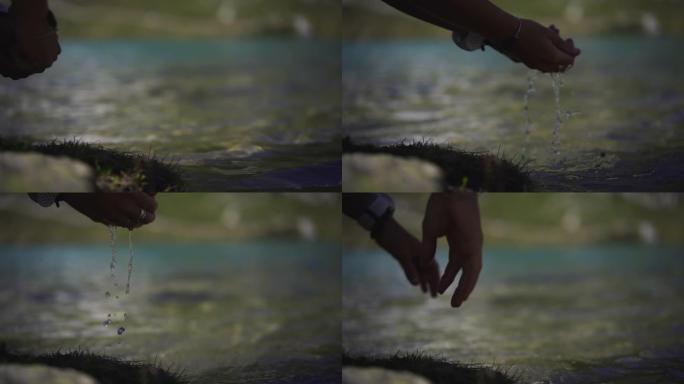 女性在河里洗手的特写镜头