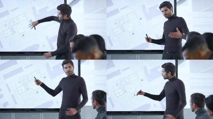 男建筑师在会议室的大屏幕上展示计划的细节