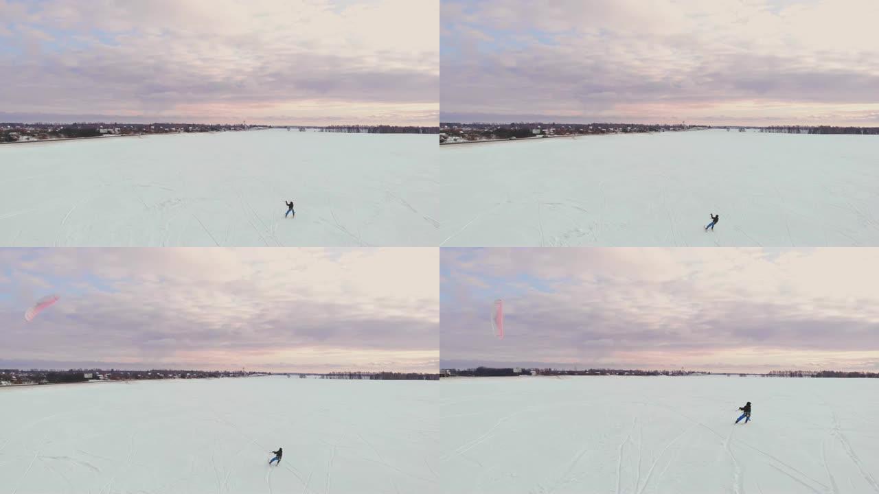 滑雪风筝上的男子拿着运动相机拍摄自拍照