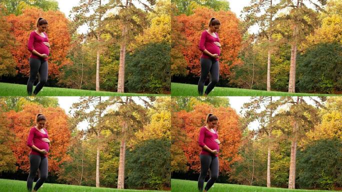 30年代初的孕妇在公园冥想和放松