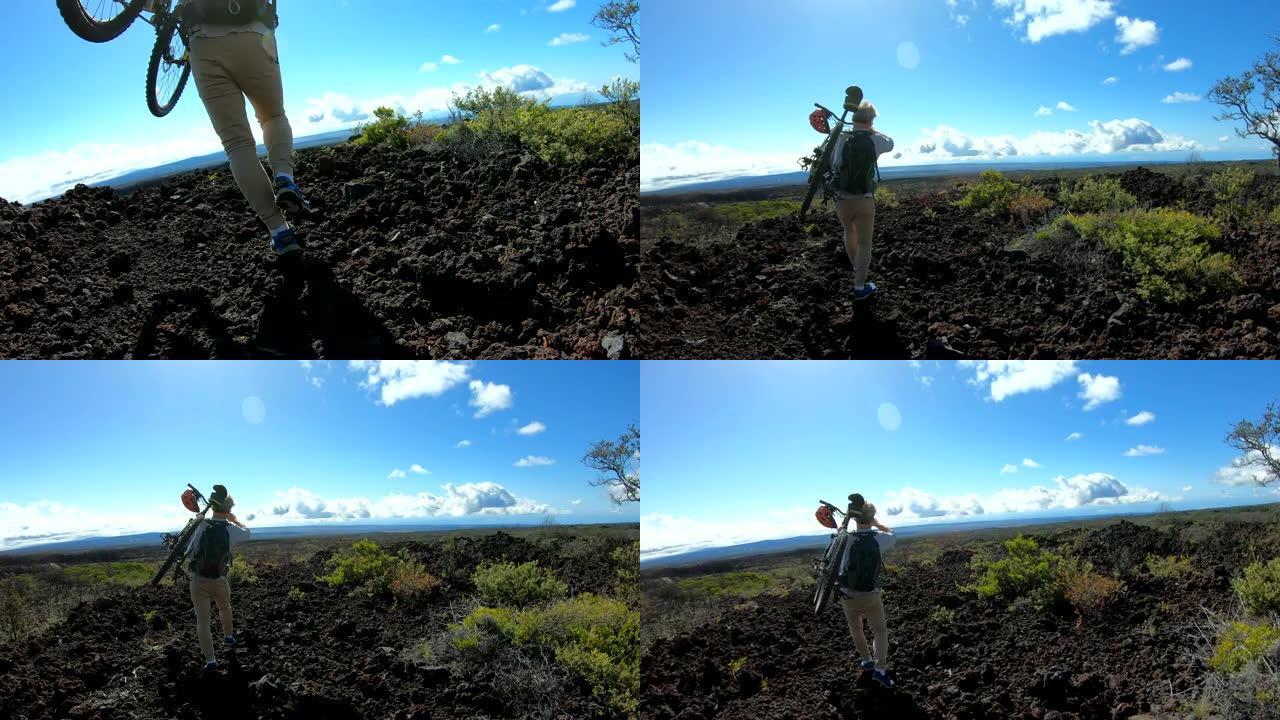 骑自行车的人在艰难的火山地形上行走的POV