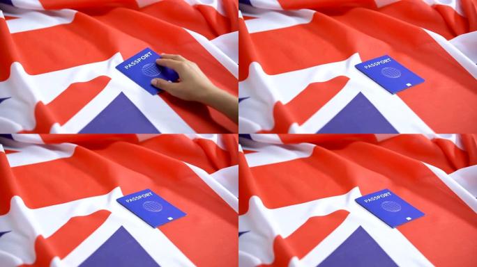 女性手将国际蓝色护照放在英国国旗上，签证申请人