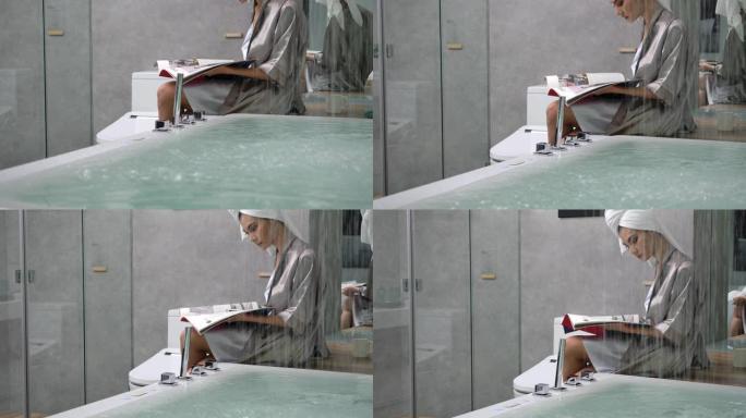 4k慢动作身材性感女人穿丝绸睡衣坐在浴缸附近阅读