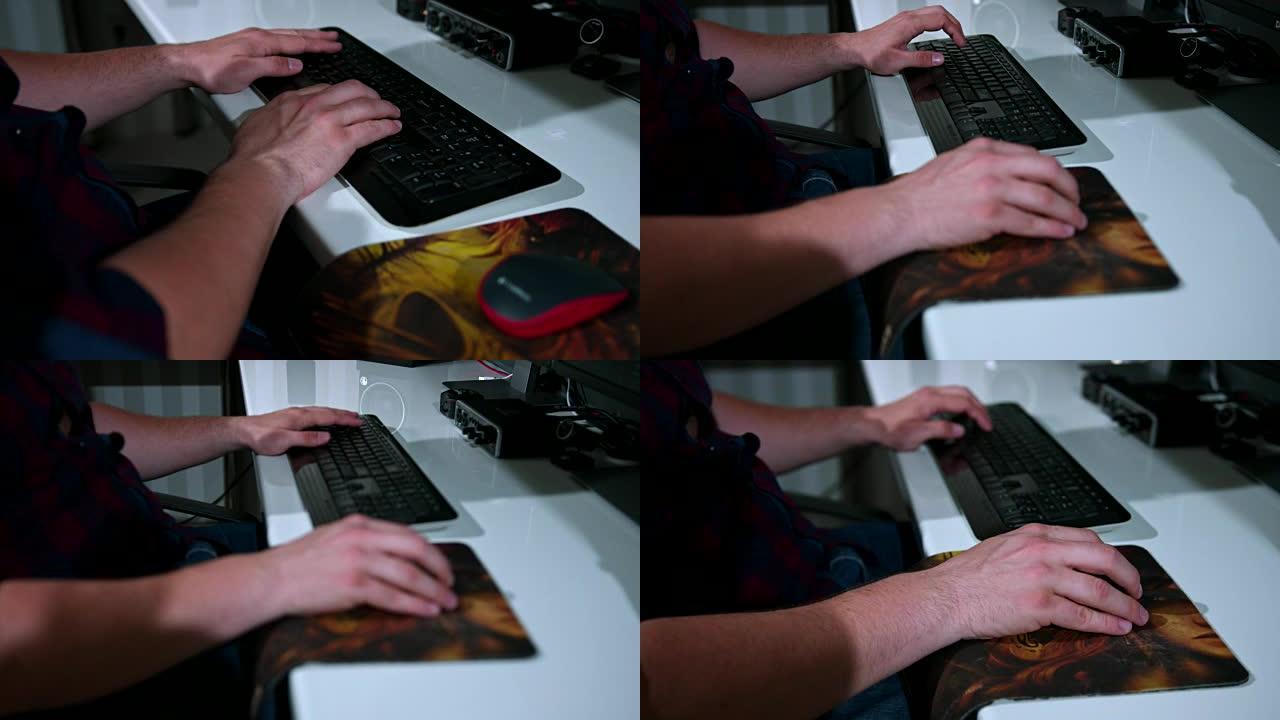 使用计算机键盘和鼠标打字近距离跟踪男性手的慢动作镜头