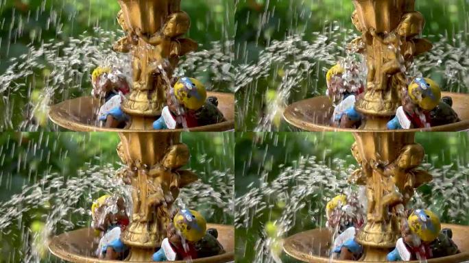 喷泉水在花园中飞溅的超慢动作/泰国