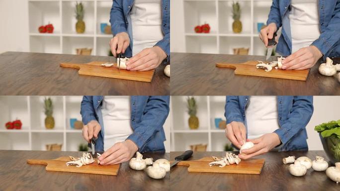 用刀切开蔬菜的手菌菇熬汤案板