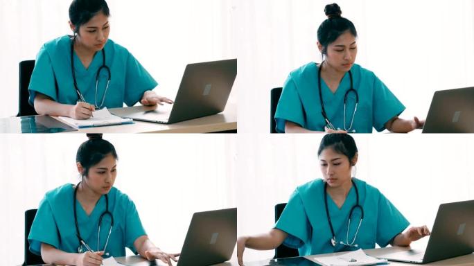 女医生在笔记本电脑上打字并在文件上写笔记