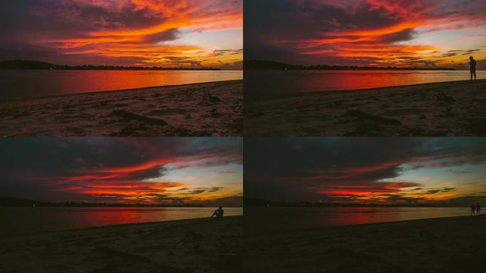 太阳落在印度尼西亚吉利岛的海上。平移视图