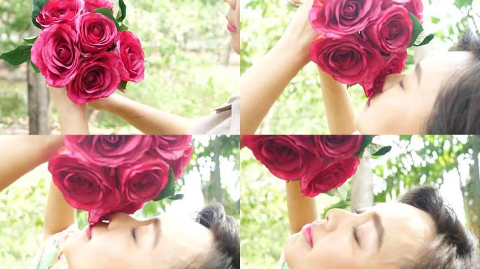 女人在公园里休息，手里拿着一束粉红玫瑰