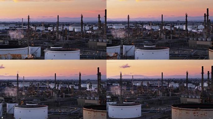 洛杉矶港大型化工厂后面的桃子日落天空