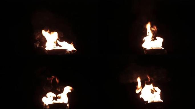 火把燃烧着火焰火焰实拍黑暗里的火把火苗