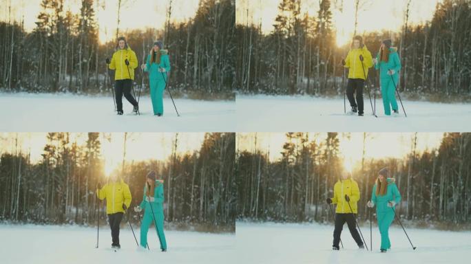 在美丽的冬季森林中，复制空间中，活跃的年轻夫妇背着滑雪板聊天的侧面肖像