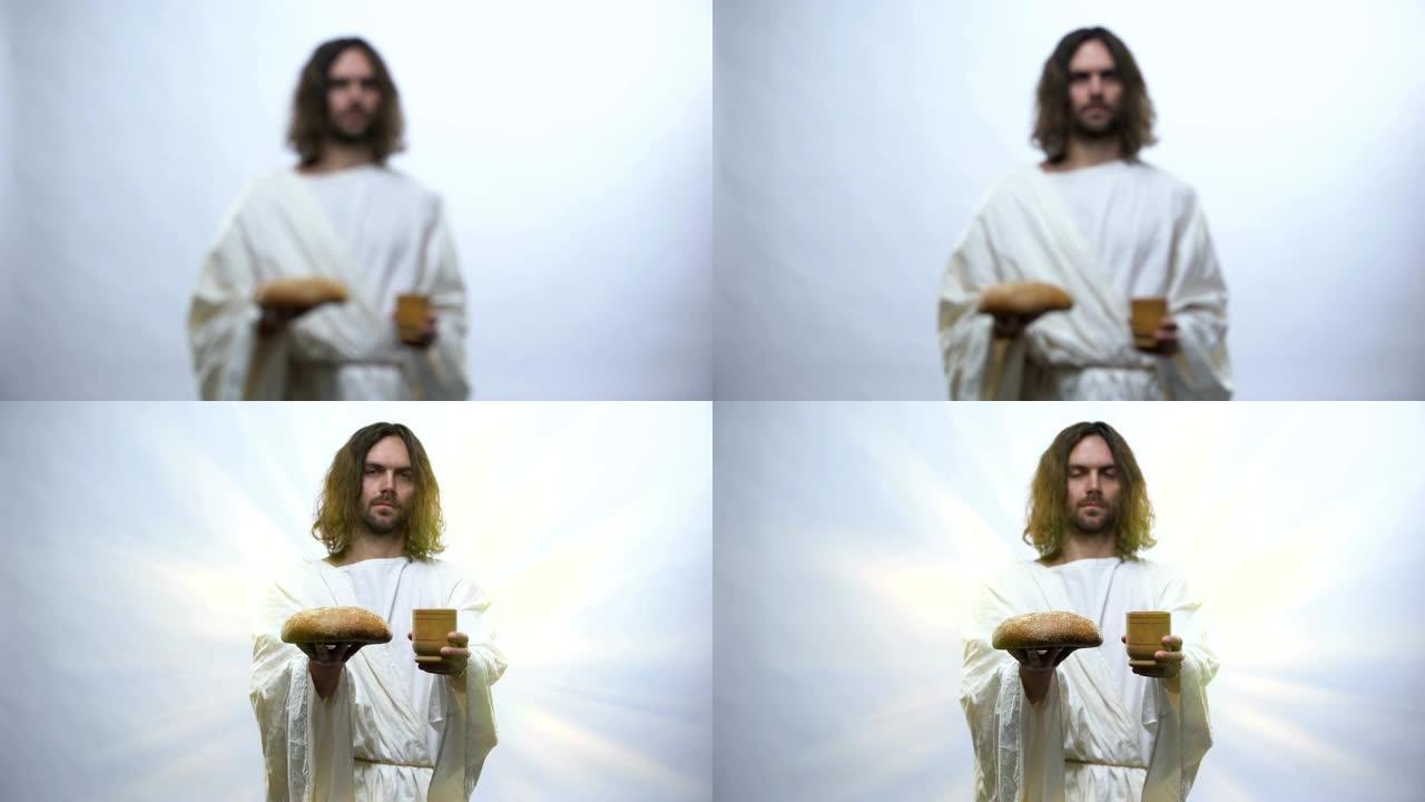 耶稣在照明背景下拿着酒和面包，基督教仪式