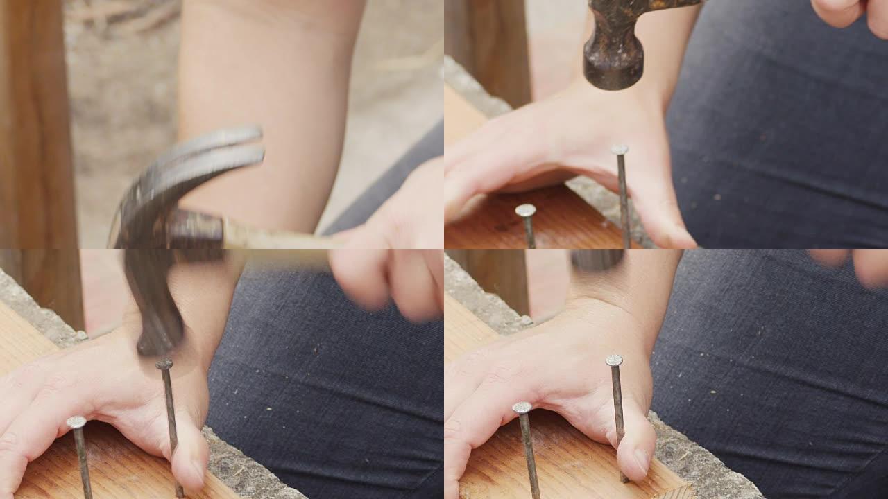 一名年轻女子用锤子在木头上慢动作地钉钉子。